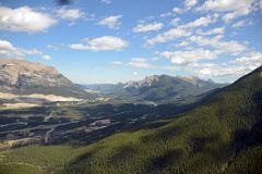 12 Canmore, Grotto Mountain, Mount McGillivary, Pigeon Mountain, Skogan Mountain, Mount Lorette As Helicopter From Lake Magog Nears Canmore.jpg